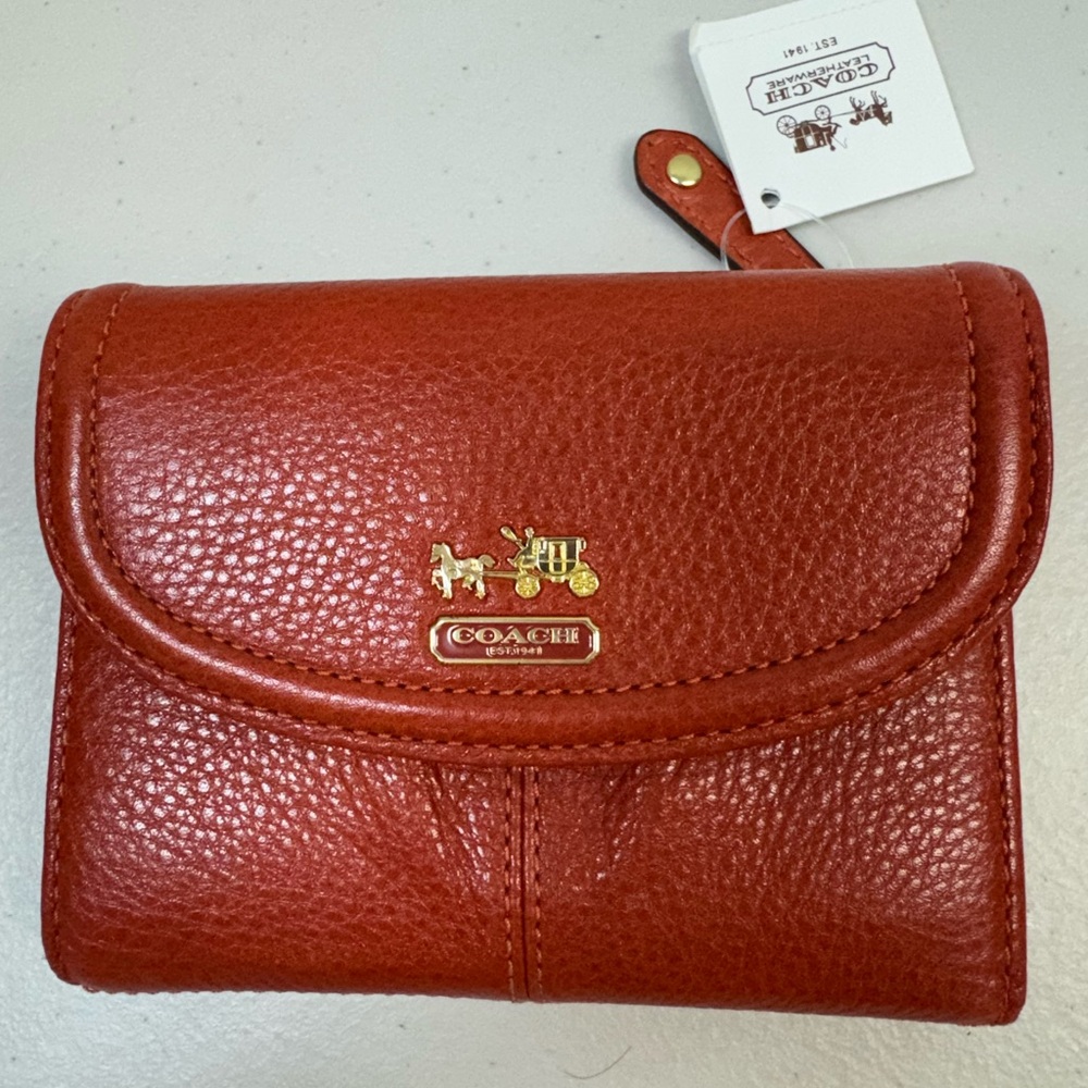 COACH Madison Women’s pebbled leather Trifold  wallet - color Persimmon.